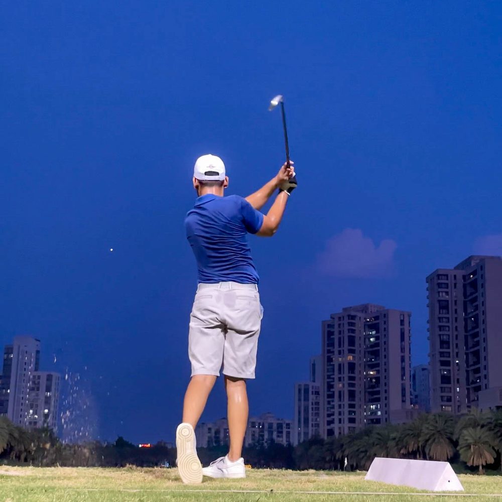 Golf — follow-through against the skyline