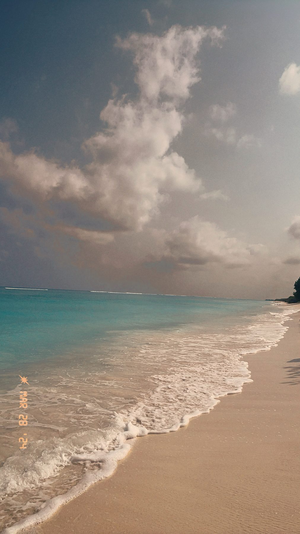 Lakshadweep — cloud bank over the lagoon at dusk