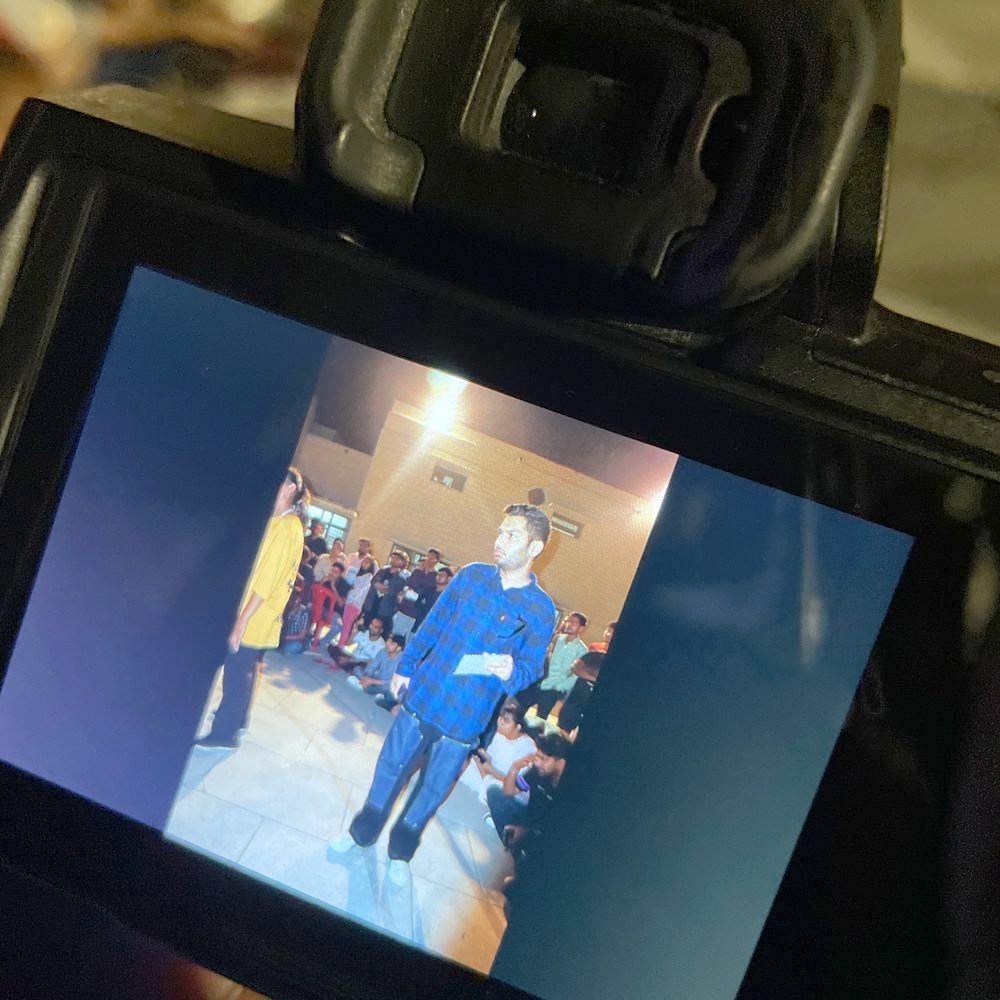 Press — framed on a camera monitor