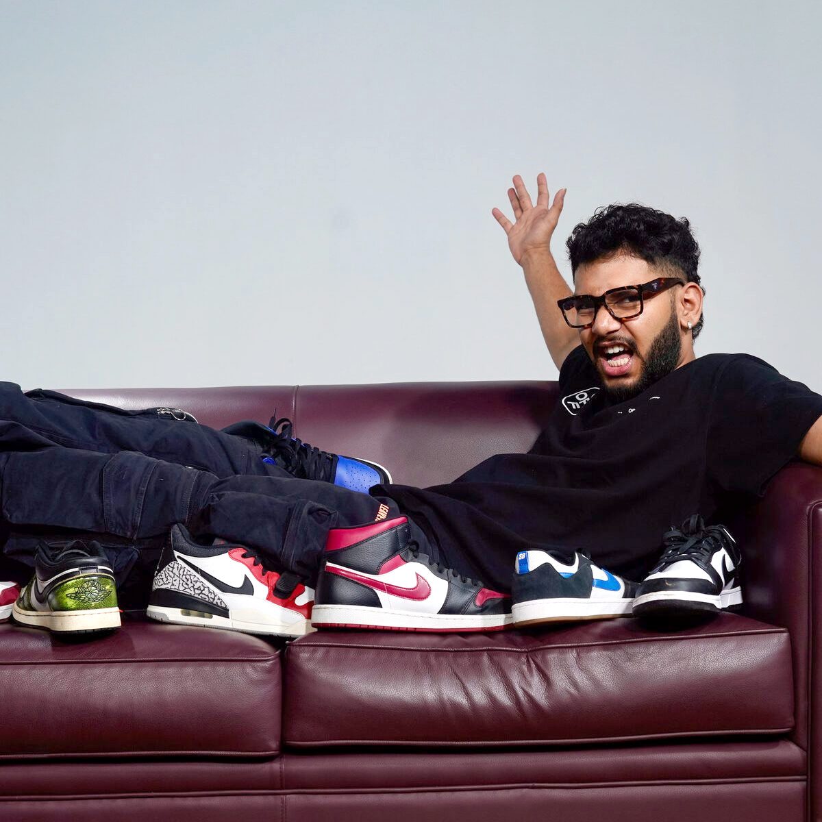 Sneakers lined up along a couch