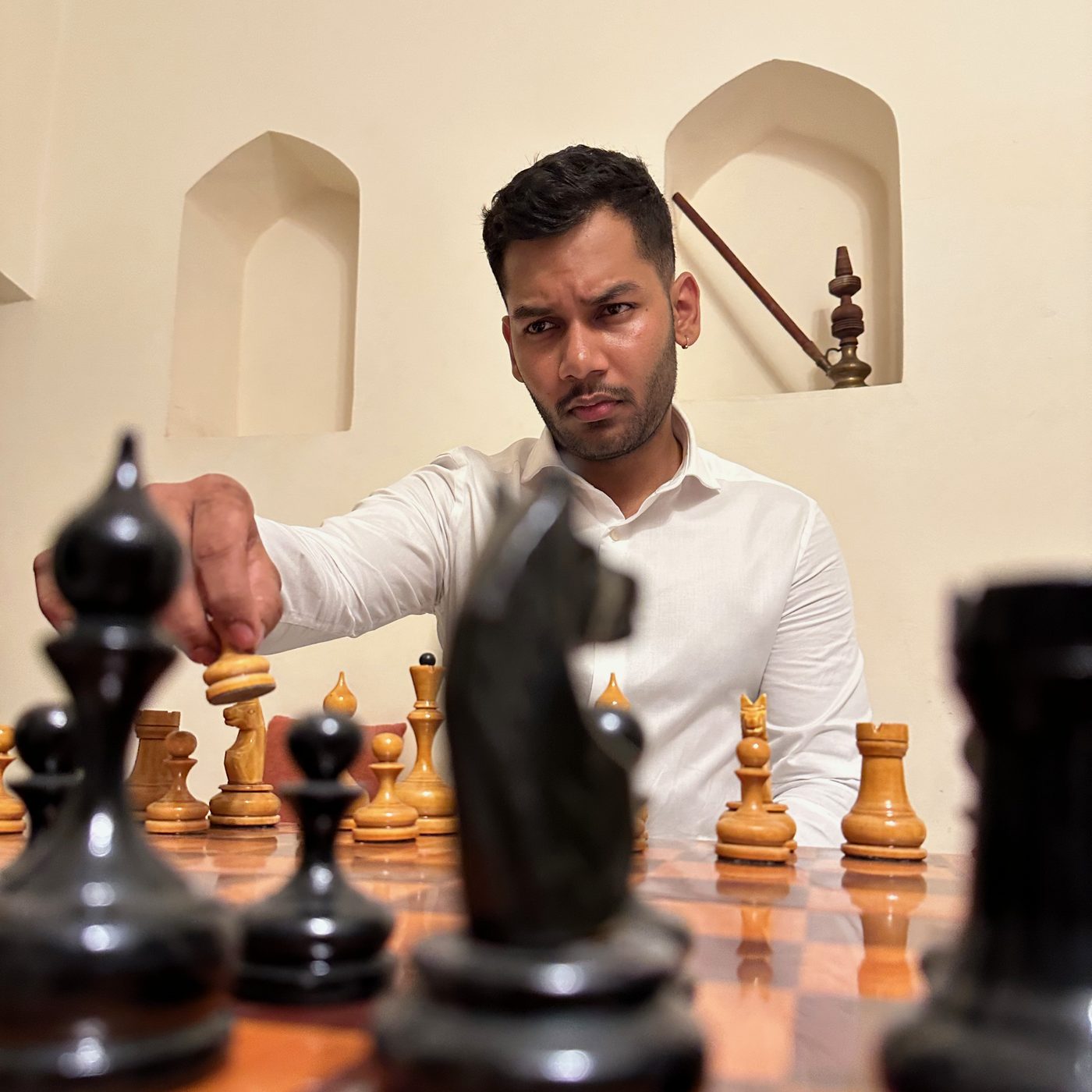 Mid-move at a chess table